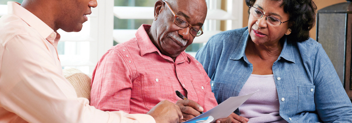 senior couple meeting with a financial advisor