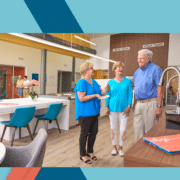 Move-In Manager Phyllis discusses design options with two residents, Jackie and Dave while standing in the Design Center
