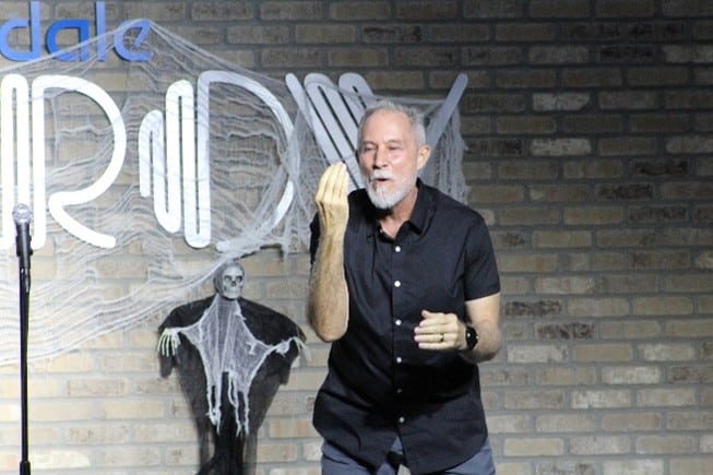 Christopher Carnrick on stage performing improv