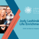 Jody Leshinsky holding an ArtServe award